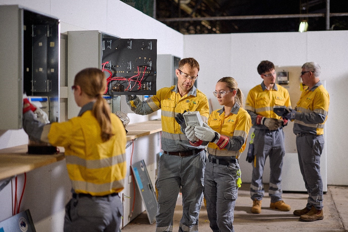 Apprentices being trained on various equipment.