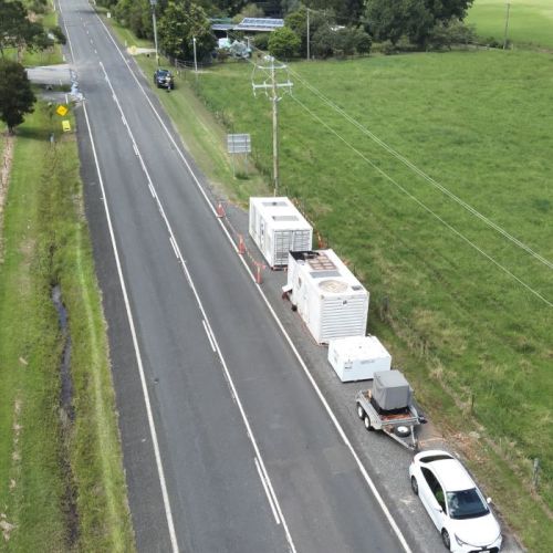 Aerial view of generation units on the side of the road with paddocks on either side