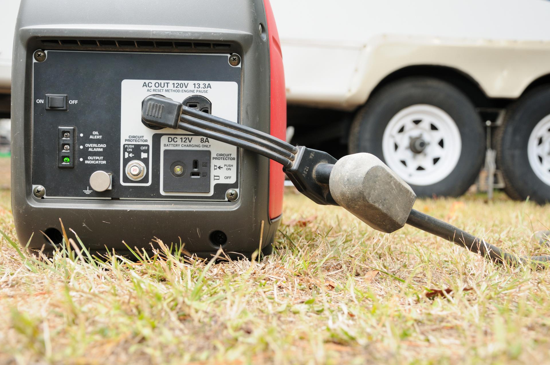 Generator on the ground running with power cable connected