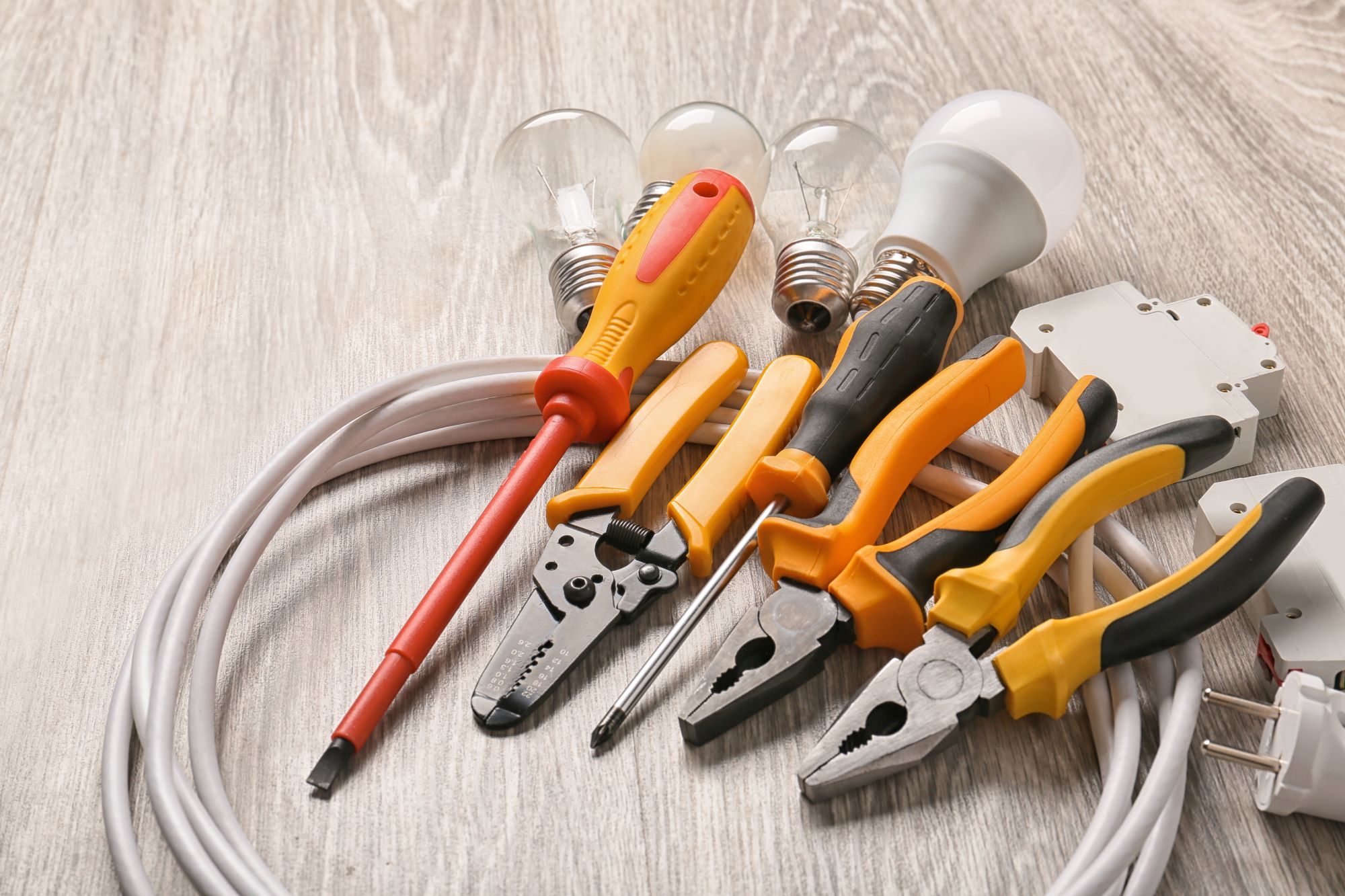 Electrician's tools laid out on a floor