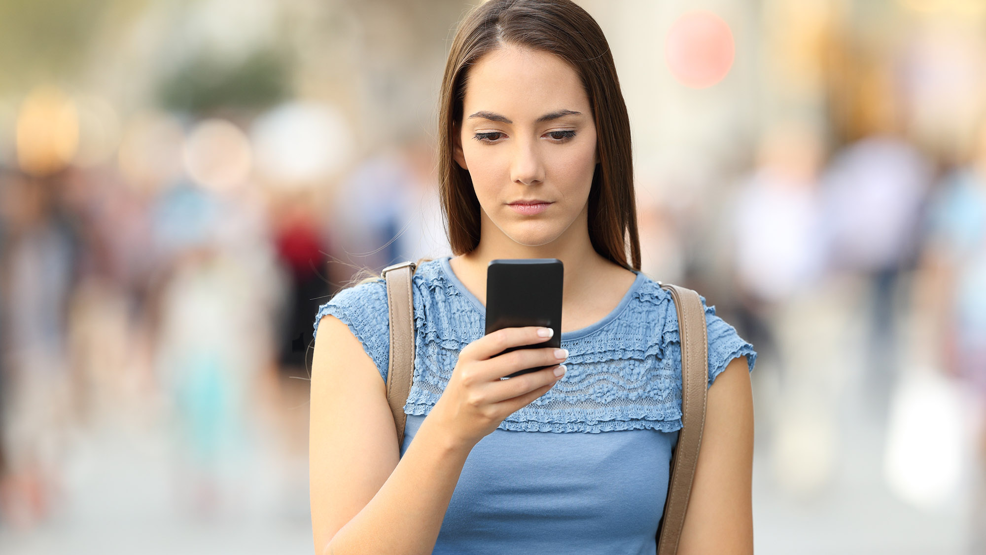 Young woman looking at a mobile phone